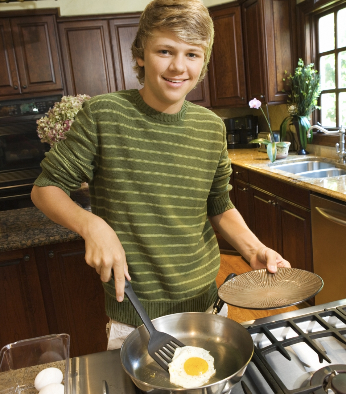 Tom cooking an egg