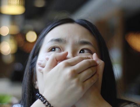 A woman with an anxious expression