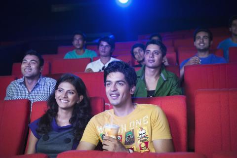 People watching a film in a cinema