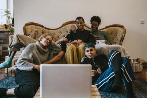 Friends watching a film on a laptop