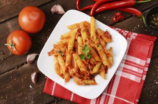 A plate of pasta in tomato sauce