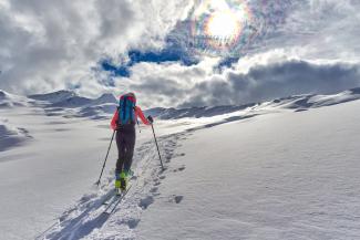 A hiker on a snowy mountain