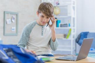 A boy making a phone call