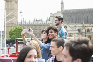 Tourists on a tour bus in London