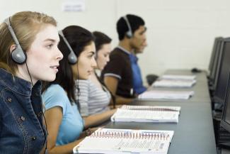 Students listening with headphones