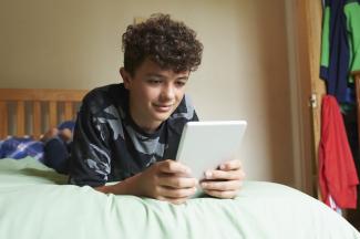 A boy using a tablet