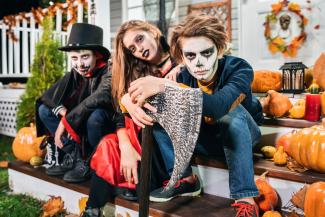 teenagers in Halloween costumes