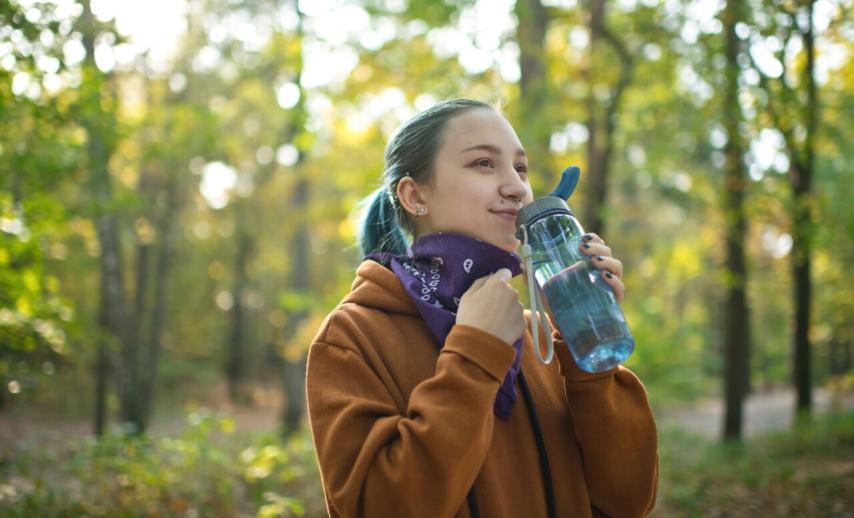 teenager drinking water