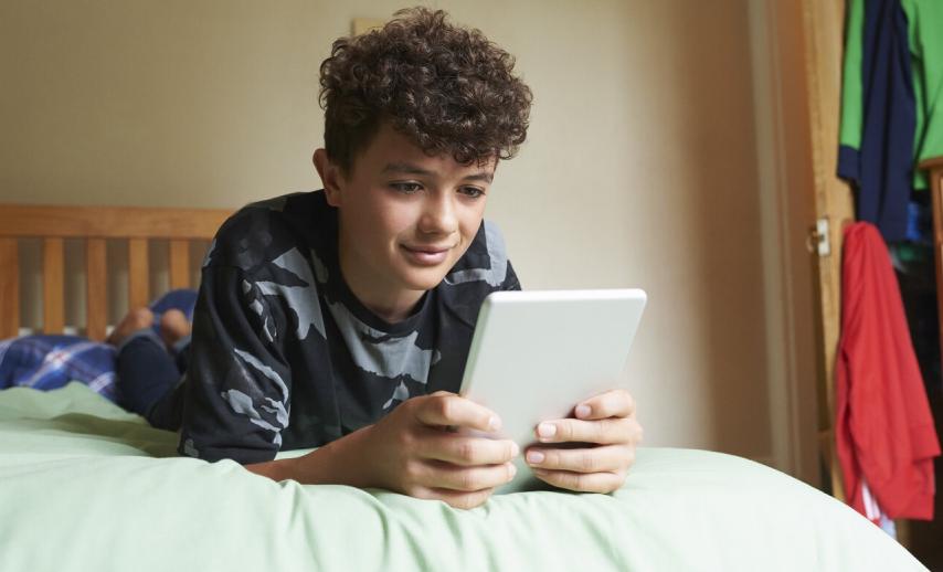 A boy using a tablet