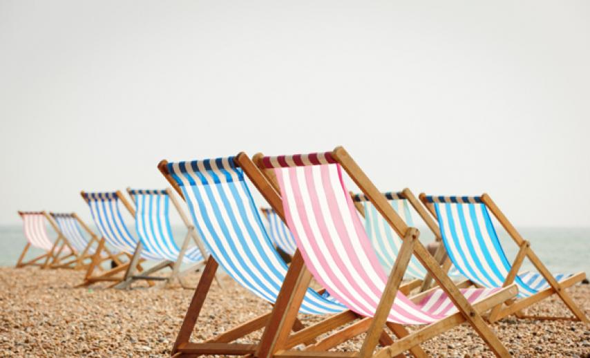 picture of deckchairs on the beach