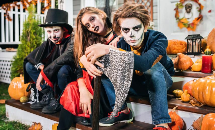 teenagers in Halloween costumes
